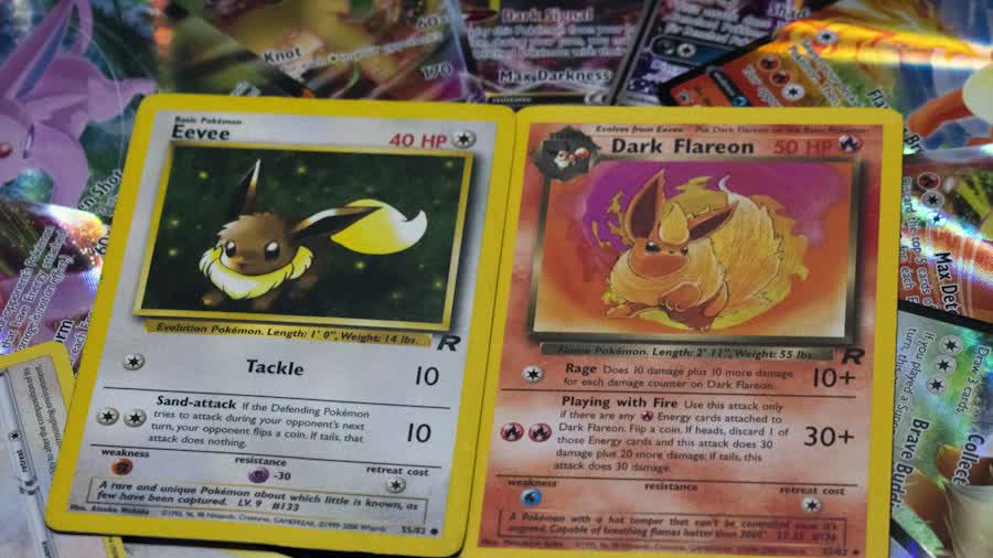 Eevee and Dark Flareon cards, the Eeveelution line behind the top Gold Star Pokemon cards