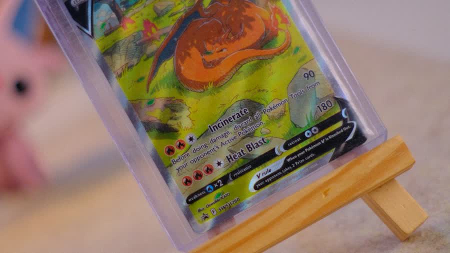 Charizard V card in a sleeve on a wooden easel, the keep-it-raw option